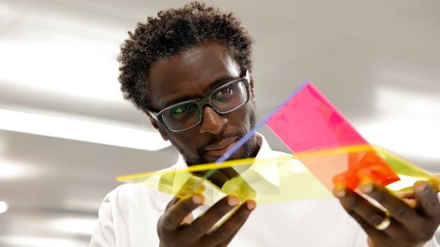 An engineer examining materials