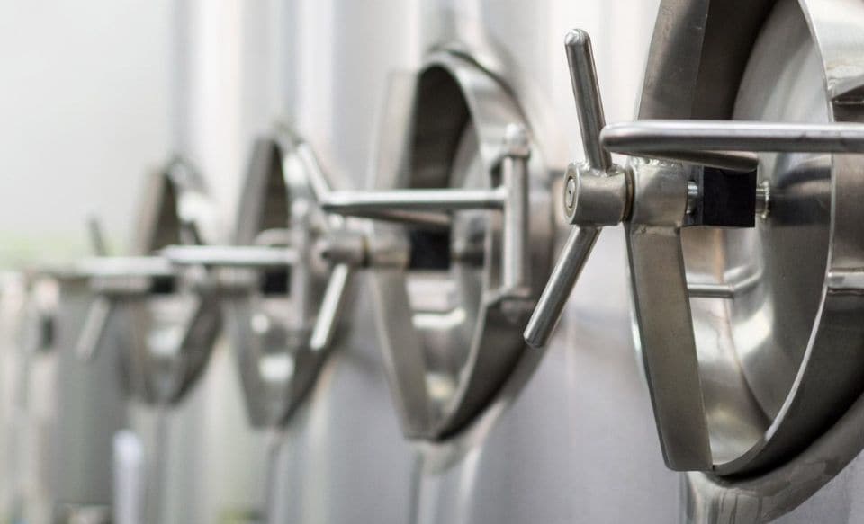 Stainless steel tanks in a dairy processing facility