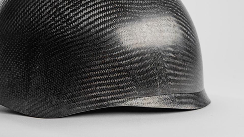 Helmet reinforced with carbon fiber materials