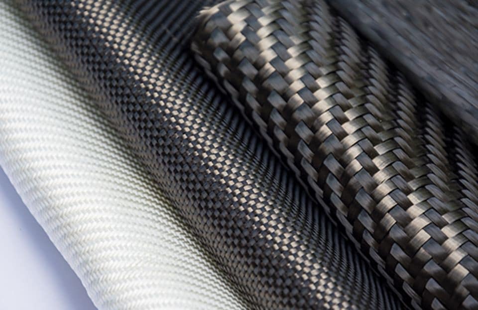 Carbon fiber materials with different weave patterns, tows, and colors