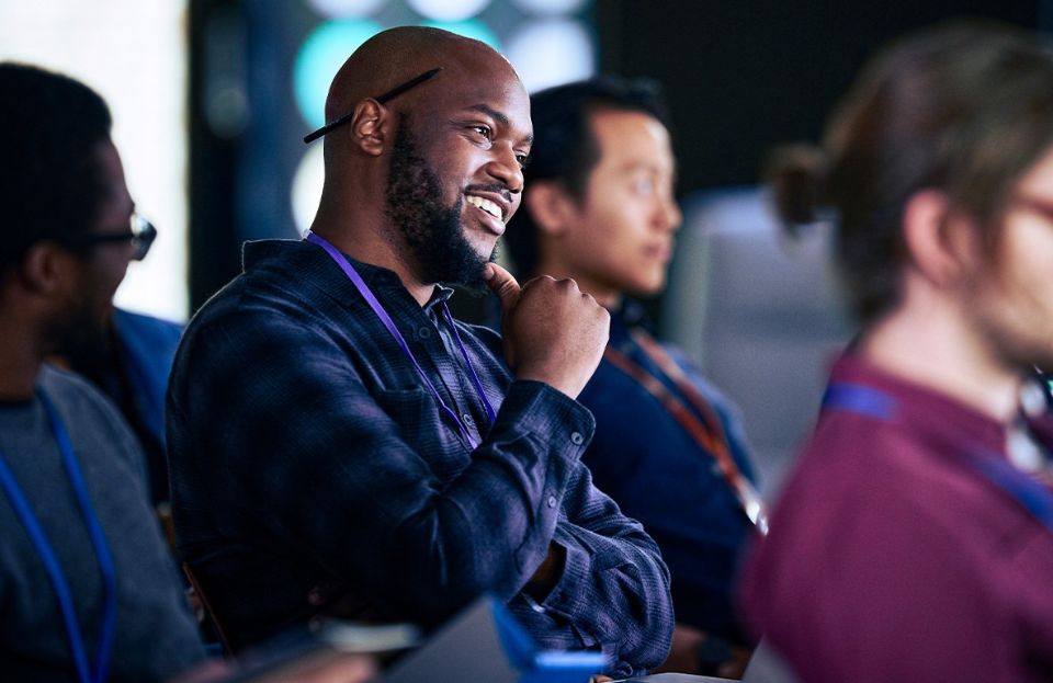 Employees listening in an information seminar